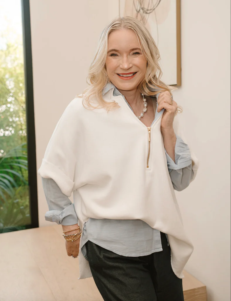 Tracy is wearing the Lucy Stretch Terry Capelet in white made from luxurious Italian cotton terry with the Andrea Pant in indigo. One of her favorite items for traveling.